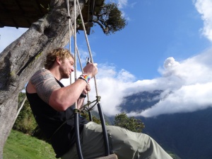 Swinging at the edge of the world as the volcano spews out ash