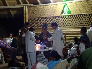 The shaman and his assistants preparing the ayahuasca. 