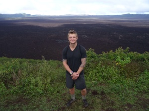 Standing in front of the 10 km crater of Sierra Negra. 